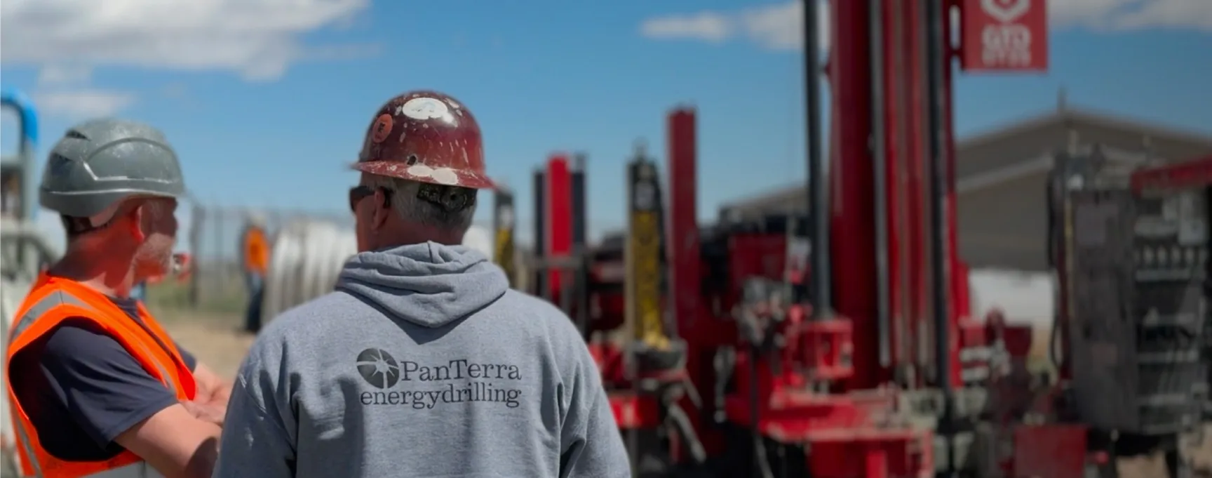Two drillers on site beside a GTD desco rig