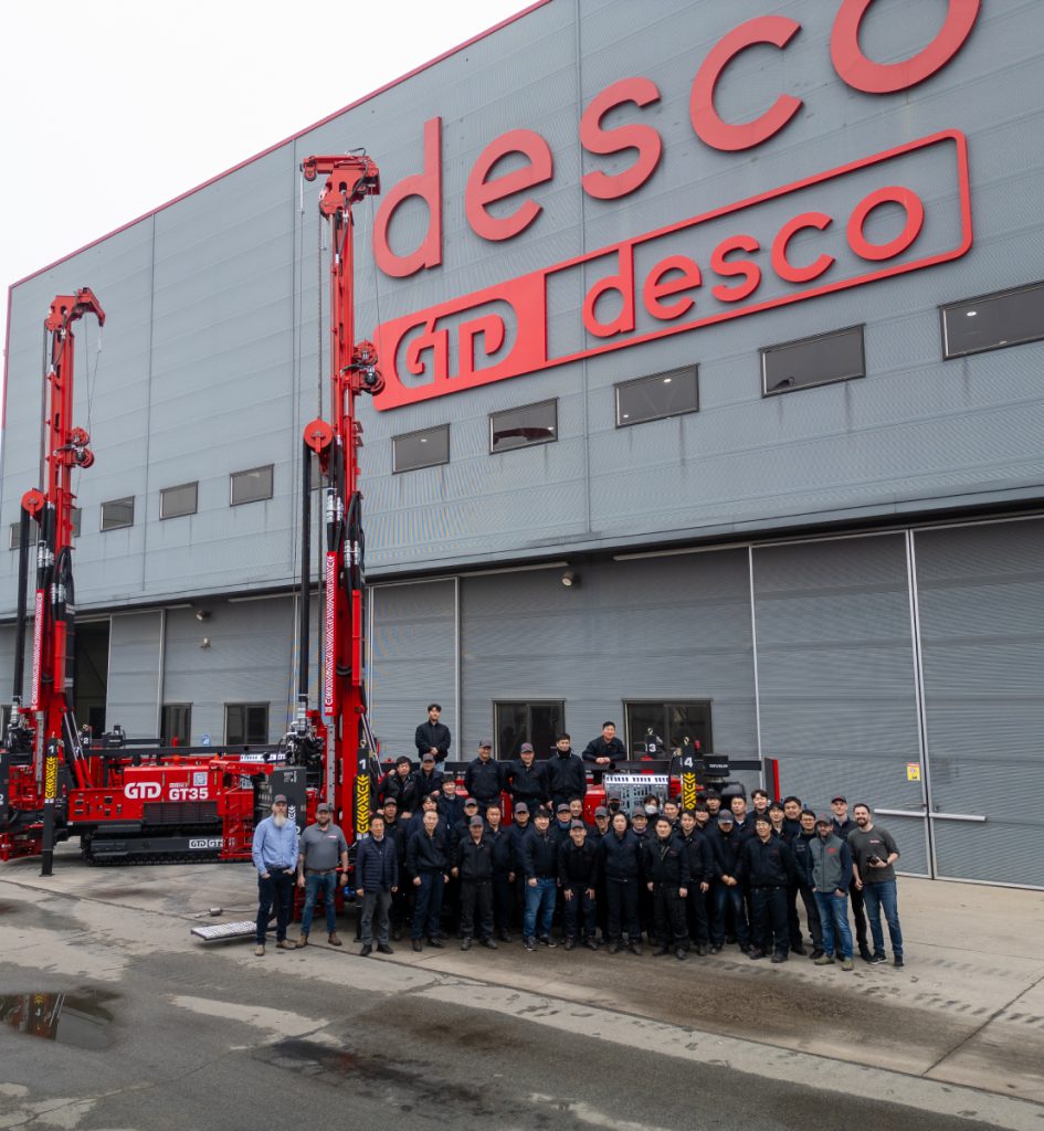 The GTD desco team in front of two GT35 rigs outside the factory